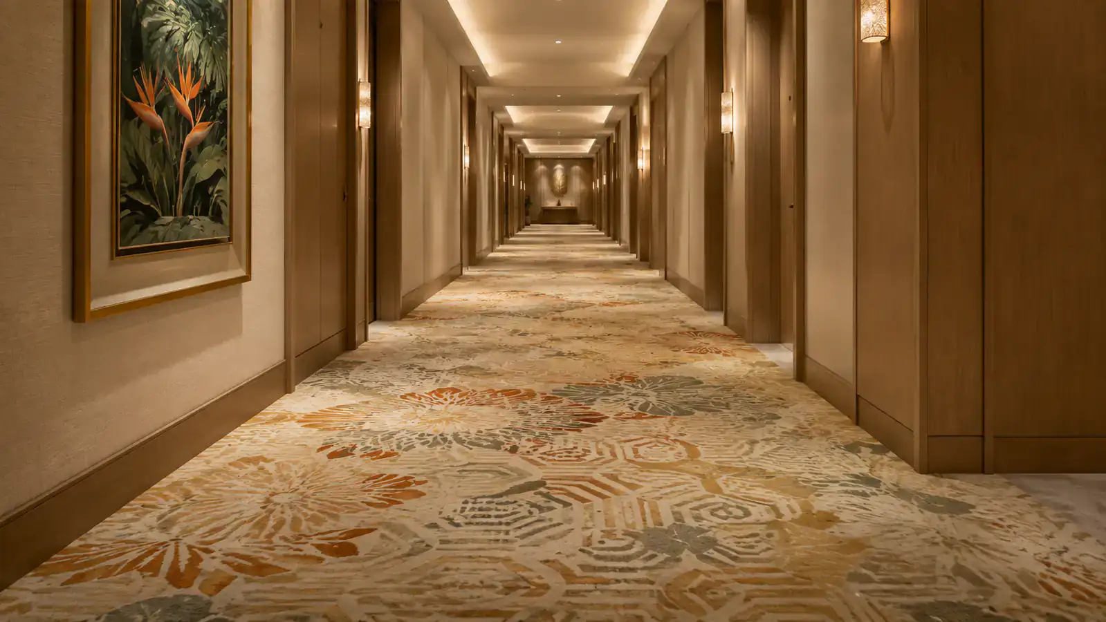 Upscale hotel corridor with balanced tropical patterned broadloom carpet for hospitality maintenance planning