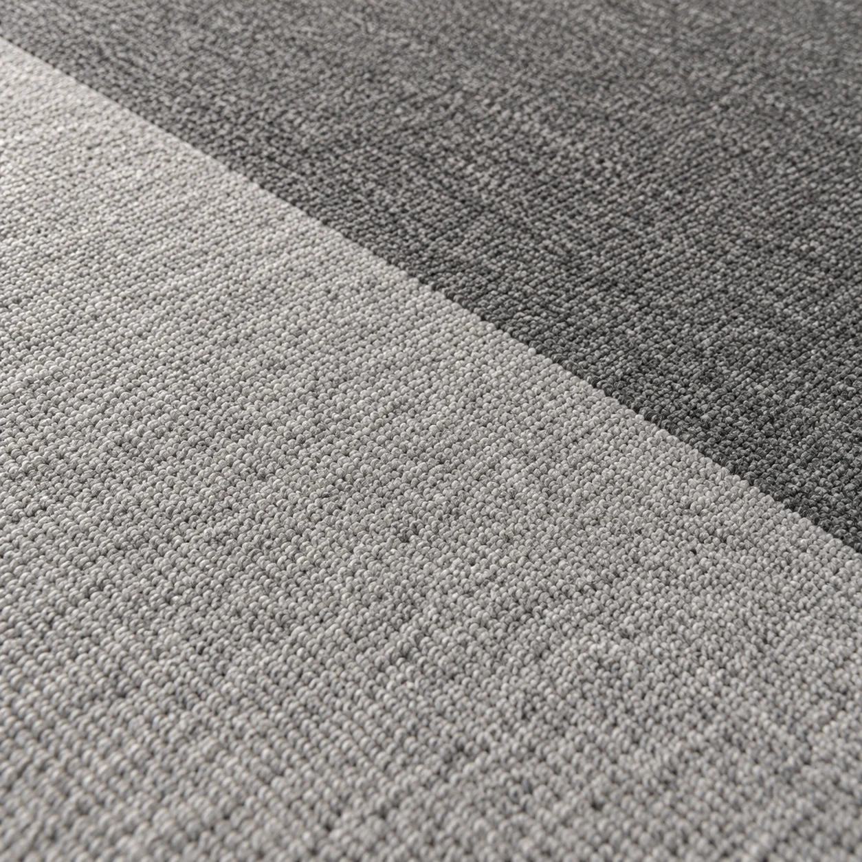 Design illustration of contrasting heathered gray carpet surfaces